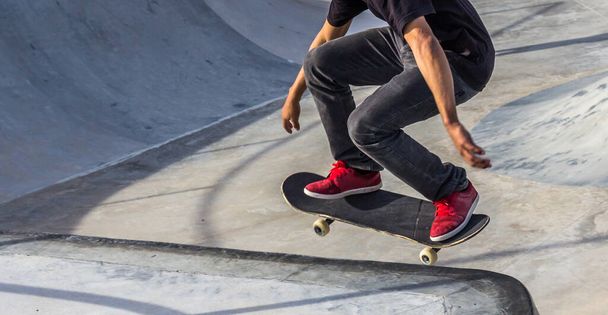 A closeup shot of a person skating in a skatepark - 写真・画像