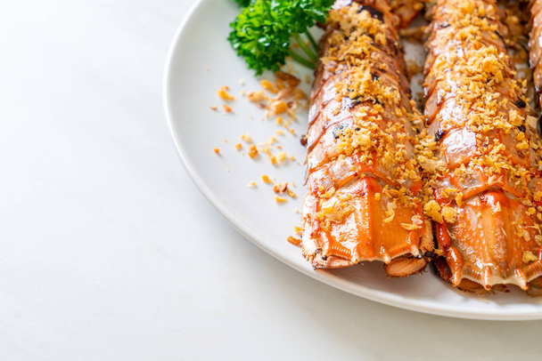 Stir Fried Mantis Shrimp with Garlic on white plate - Valokuva, kuva