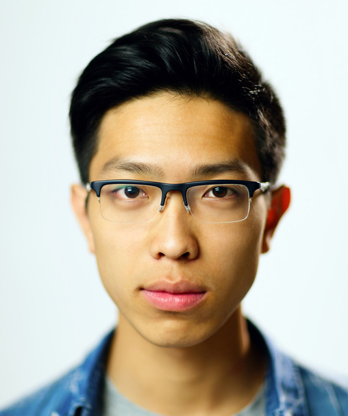 Young handsome asian man in glasses - Fotó, kép