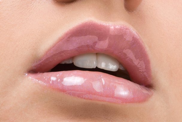 clse up of a red mouth with lipstick and lip gloss - Foto, imagen
