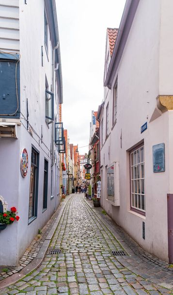 Bremen, Germany- June 28, 2019: Narrow street of the old town in the historic Schnoor district. - 写真・画像