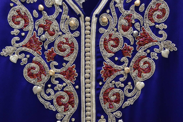 Details of a blue Moroccan caftan for women,  and golden lac - Photo, Image