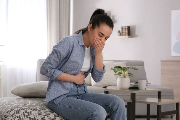 Young woman suffering from nausea at home. Food poisoning - Φωτογραφία, εικόνα