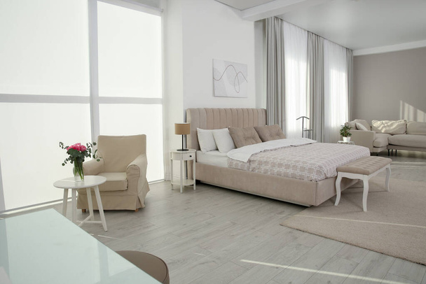 Stylish hotel bedroom interior with modern furniture - Fotó, kép