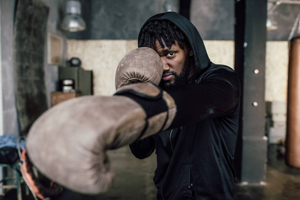 black boxer. Punch to the camera, close-up - Foto, Imagem
