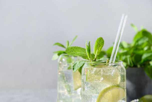 Mojito with, lime mint and ice cube on gray background. - Foto, Imagen