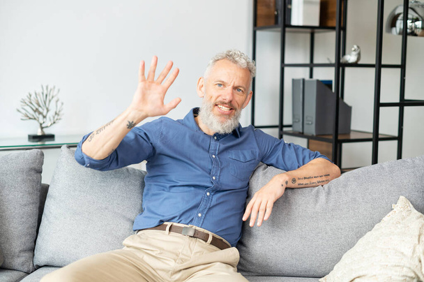 Video connect with modern mature grey-haired man - Foto, afbeelding