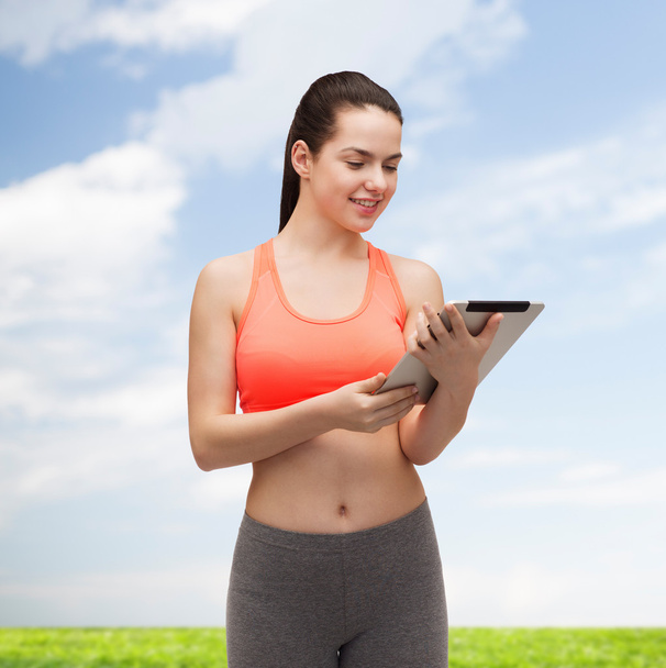 sporty woman with tablet pc computer - Zdjęcie, obraz