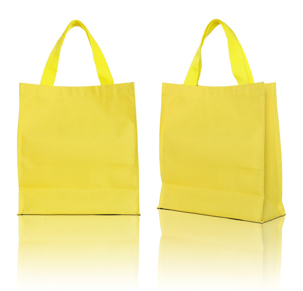 beyaz zemin üzerine sarı alışveriş çantası  - Fotoğraf, Görsel