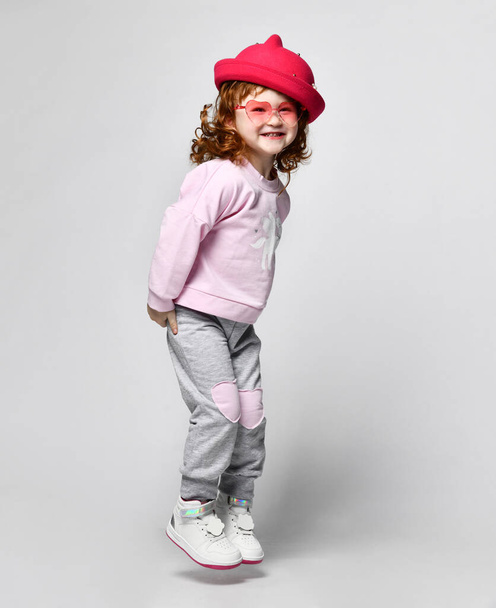 Cute little smiling giggling preschool toddler girl child studio shot - Foto, Bild
