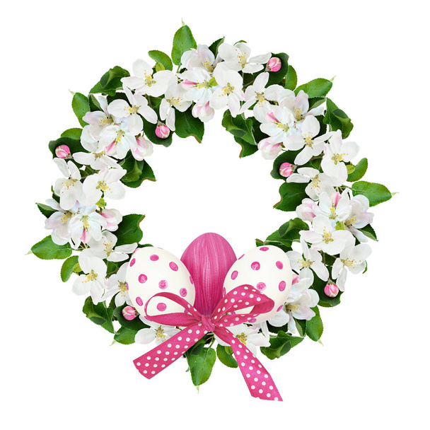 Round wreath with apple tree flowers and Easter eggs isolated on white background.  - Foto, imagen