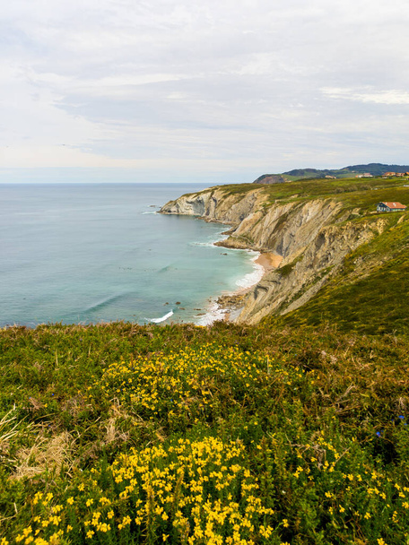 A beautiful view of a green cliff and a cloudy sky - Photo, Image