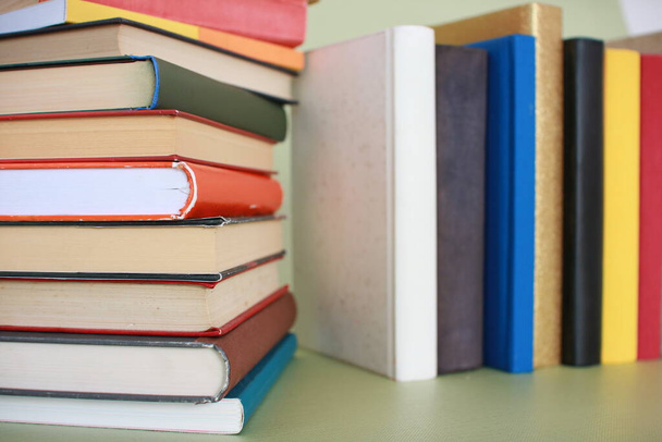 Stack of books on green background - Photo, Image