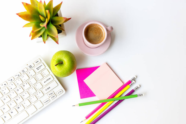 Healthy snack with working in the office.  Green apple pink cup black coffee for diet Health life with laptop on white dress working, write take care white background.  Healthy Lifestyle Concept, top view - Fotografie, Obrázek