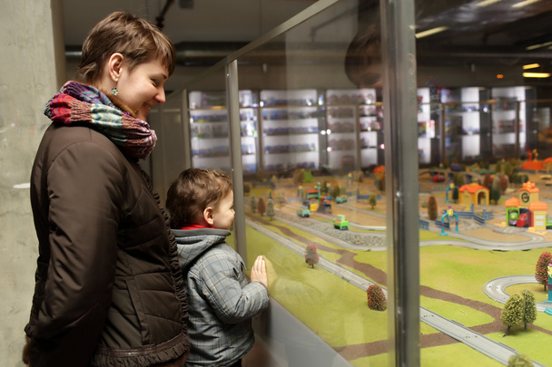 Family looking at toy country - Foto, Bild
