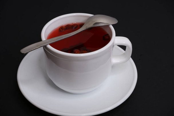Fruit tea on a black background. - Foto, afbeelding