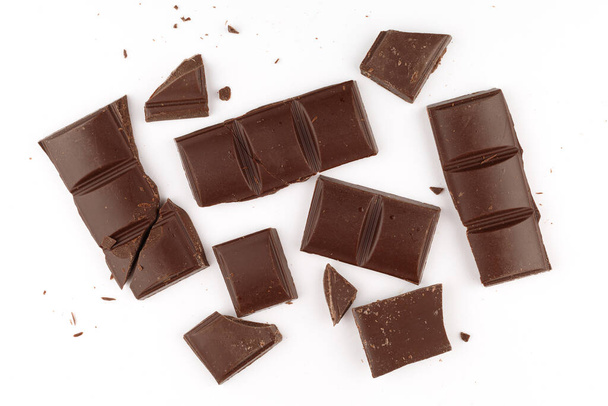 Pieces of dark chocolate on a white background isolate - Foto, immagini