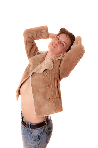 studio portrait of a girl in a sheepskin coat - Foto, afbeelding