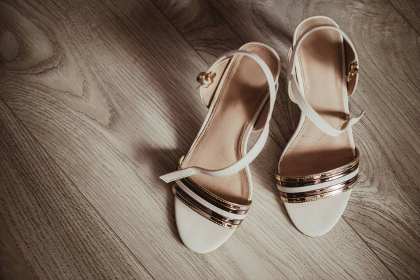 wedding shoes on the wooden background - 写真・画像
