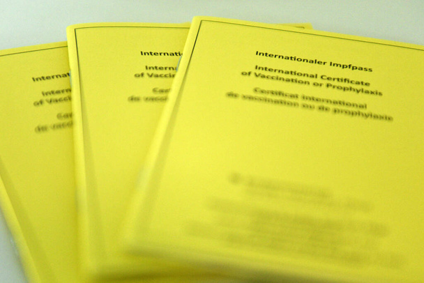 Yellow international vaccination certificate in Austria - Photo, Image