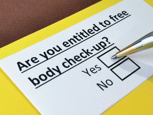 One person is answering question about free body check up. - 写真・画像