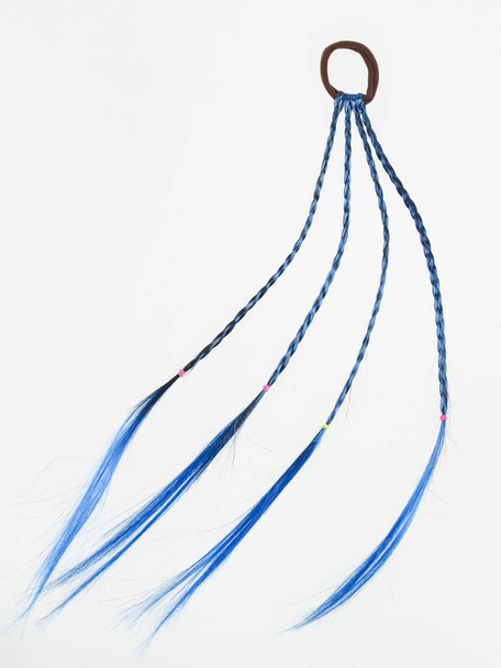 Children's hair ornaments. Blue pigtails on a white background. - Photo, Image