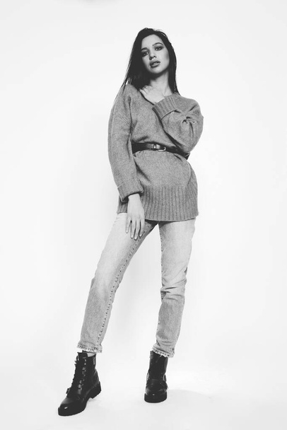 Beautiful, stylish brunette female model posing in studio on isolated background. Style, lifestyle, fashion concept. - Fotó, kép