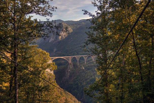 DURMITOR National Park, Montenegro, Concrete arched bridge (Djurdjevica Tara 1937) spanning the Tara River Canyon - Photo, Image