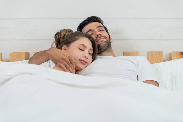 Loving couple lying and hugging in bed, love and relationships concept - Zdjęcie, obraz