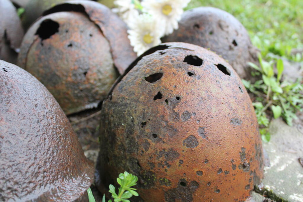helmets of Soviet soldiers of the Great Patriotic War / photo of helmets of Soviet soldiers. During the Great Patriotic War, they protected the head. the helmets are old, rusty, with holes in the metal. - Photo, Image