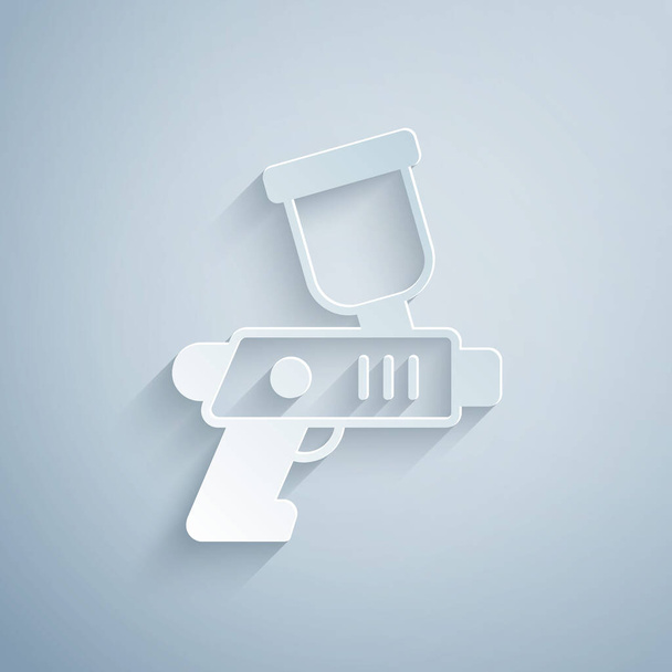 Cięcie papieru Paint spray ikona pistoletu izolowane na szarym tle. Papier w stylu sztuki. Wektor - Wektor, obraz