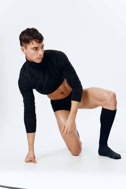 man in short t-shirt panties and socks pumped up torso striptease model  - Fotografie, Obrázek