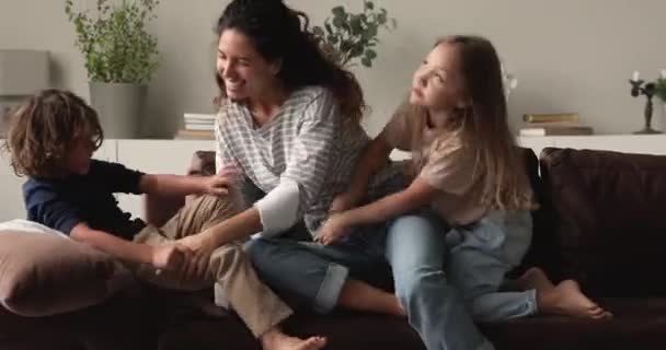 Loving millennial hispanic nanny having fun with children. - Filmmaterial, Video