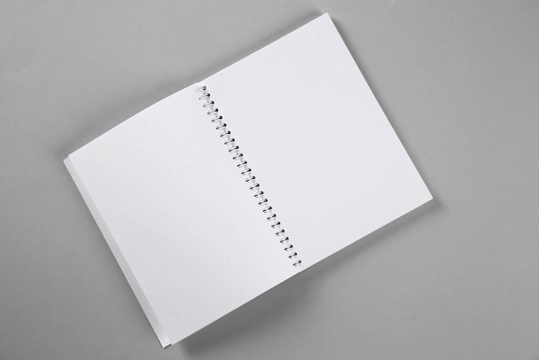 Open blank notebook on grey background, top view. Mockup for design - Foto, afbeelding