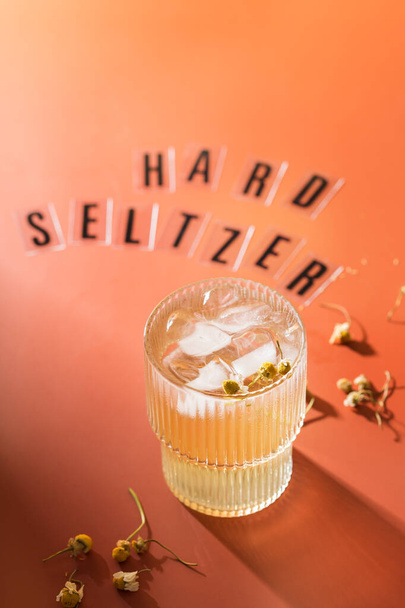 Hard seltzer cocktail with chamomile and ice - Photo, Image