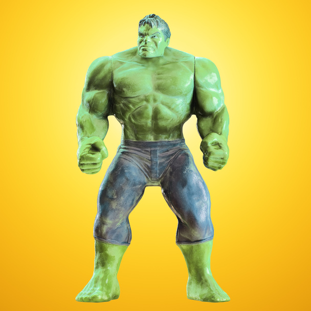 A green toy hulk stands with fists clenched against a yellow backlit background. Front view. 3d rendering - Photo, Image