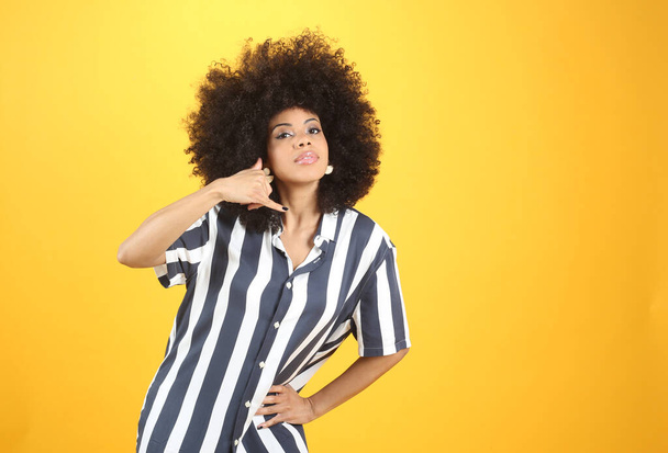 pretty young afro woman, with call gesture - Photo, Image