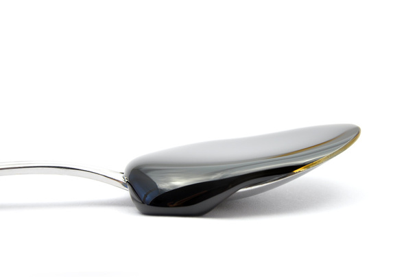 Sugar beet molasses on spoon - Photo, Image