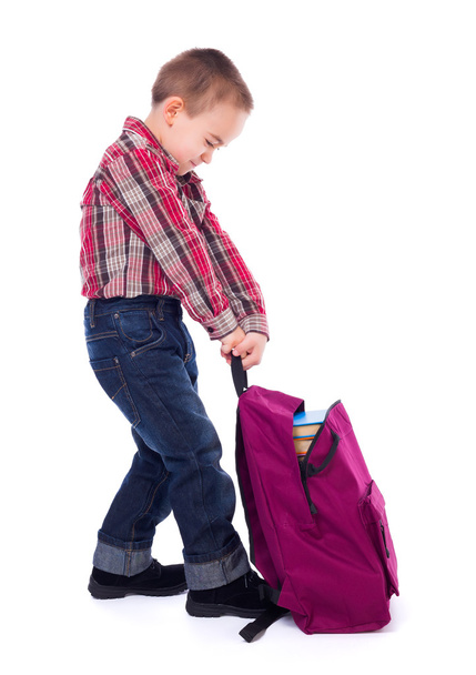 Little boy with heavy schoolbag - 写真・画像