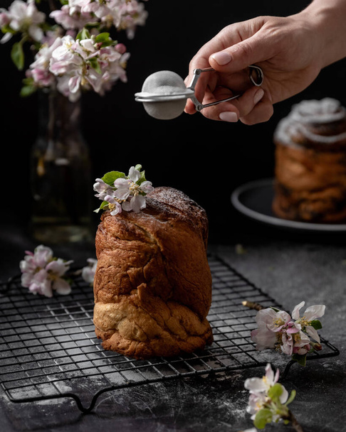National Russian Easter bread Pasxa Kulich Pasha on a dark background , sliced  - Foto, Imagem