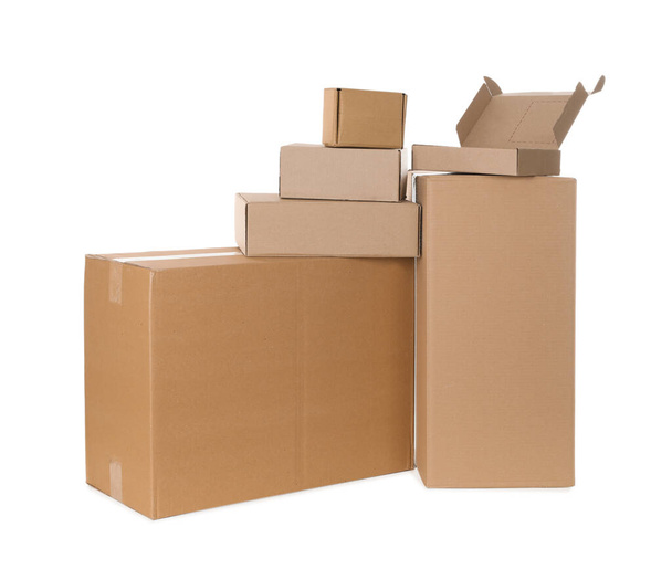 Pile of cardboard boxes on white background - Foto, afbeelding