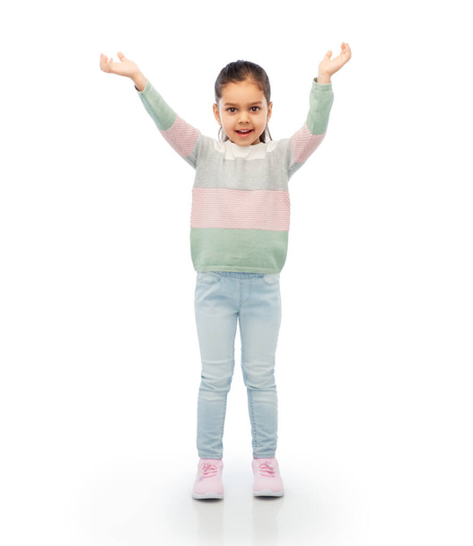 happy girl with raised arms over white background - Фото, изображение