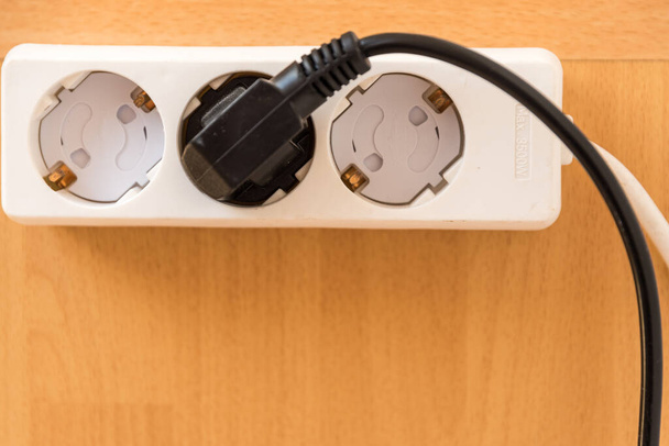 Multiple socket with child safety device - multiple socket outlet with fuse for children, close-up, copy space - Photo, Image