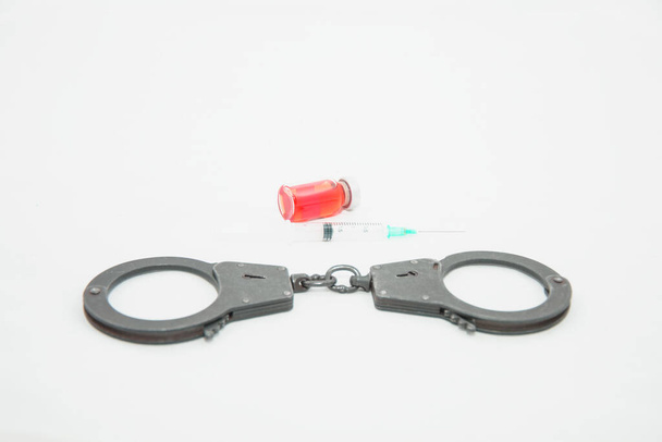 Metal police handcuffs on a white background close up - Photo, Image