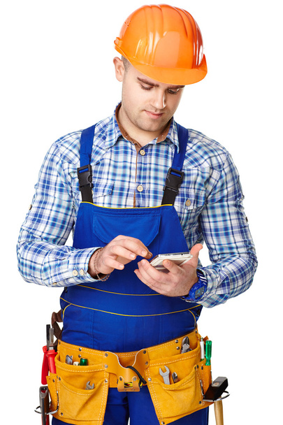 Young construction worker with smartphone - Photo, Image