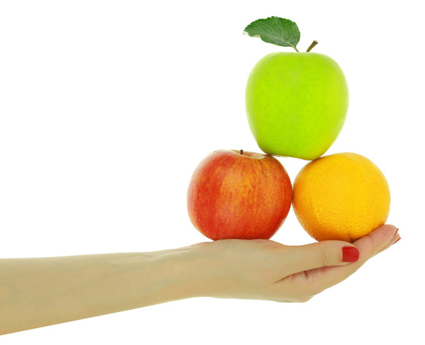 weibliche Hand mit frischen, farbenfrohen Früchten isoliert auf weiß - Foto, Bild