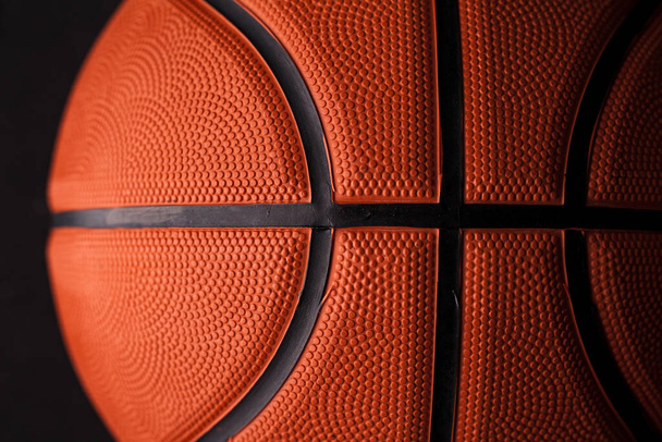 Μπάσκετ καουτσούκ πορτοκαλί μπάλα γκρο πλαν φόντο υφή. - Φωτογραφία, εικόνα