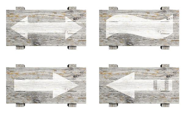 Velhos sinais de madeira com setas isoladas em branco
 - Foto, Imagem
