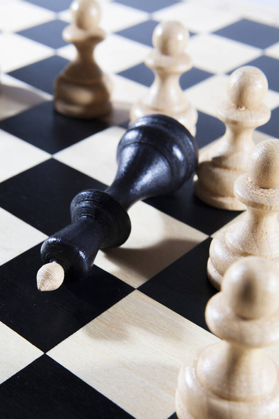 White pawns defeat the lone black king - Valokuva, kuva