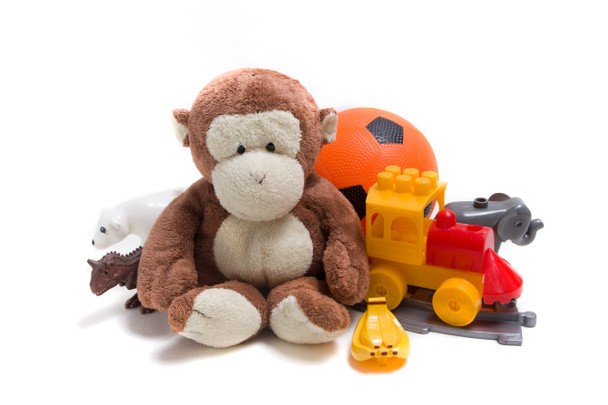 Children's toys on a white background. Constructor, ball and soft toys for children's development - Foto, Imagen